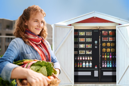 Ein Automat als Hofladen mit einer Bäuerin im Vordergrund