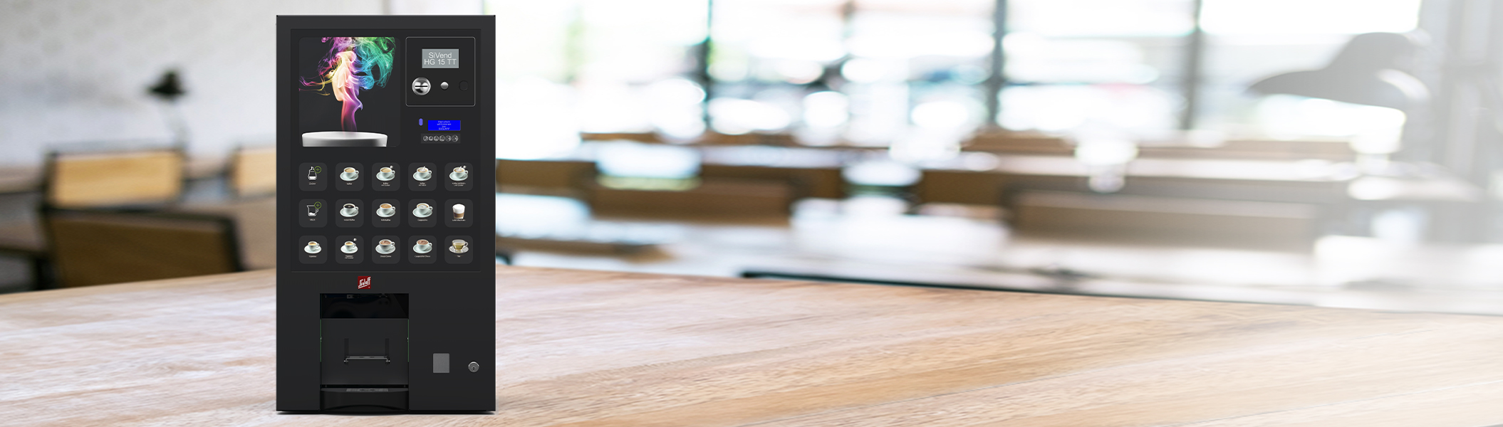 Der Heißgetränkeautomat SiVend HG 15 TT auf einem großen Holztisch